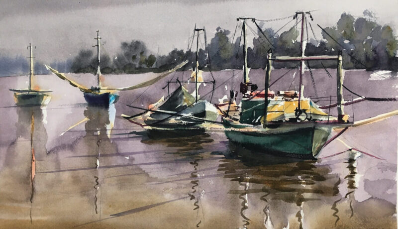 Barcas junto a la orilla en Coria del Río